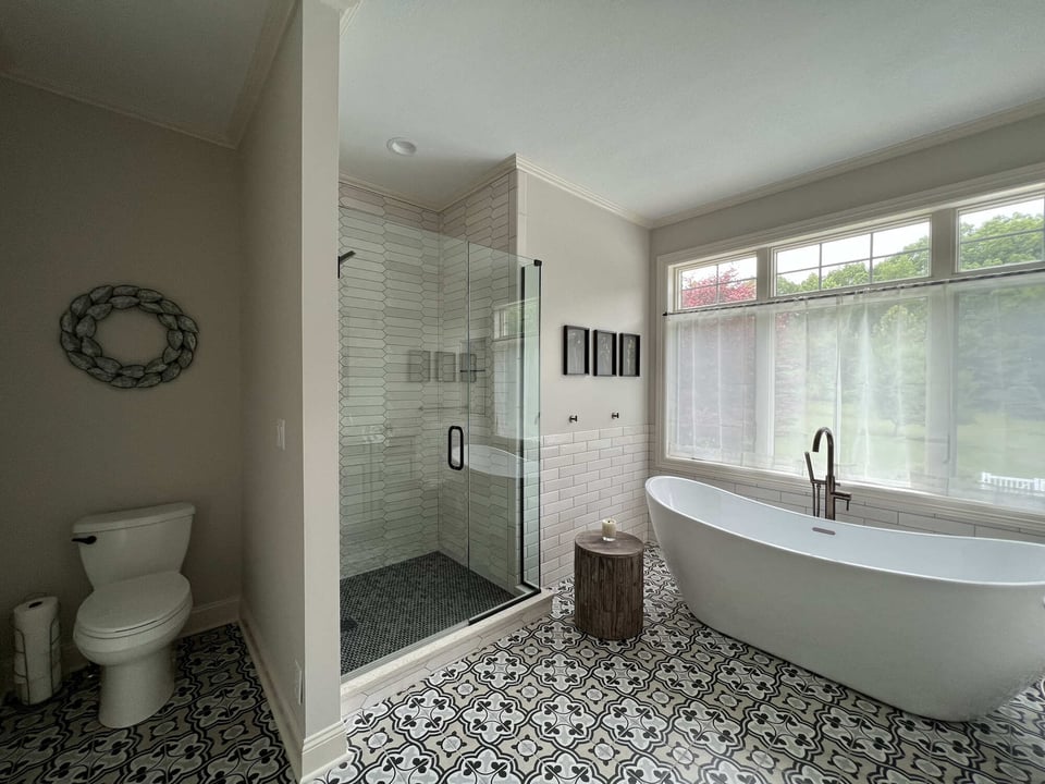 Freestanding soaking tub beside walk-in shower in Barbour Construction custom bath, Dowagiac, MI.