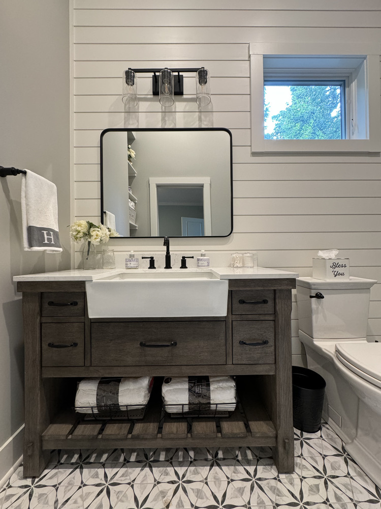Shiplap bathroom wall and rustic vanity remodel by Barbour Construction in Buchanan, MI.