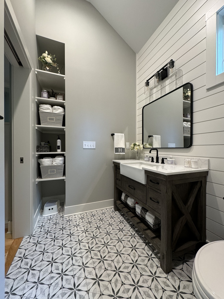 Stylish bathroom storage and vanity area in a Buchanan, MI custom home by Barbour Construction.
