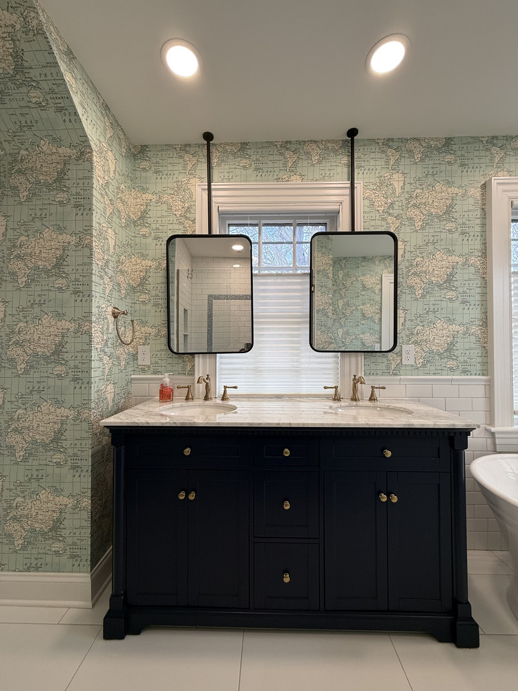 Double vanity with marble countertop and dual mirrors in South Bend bathroom by Barbour Construction
