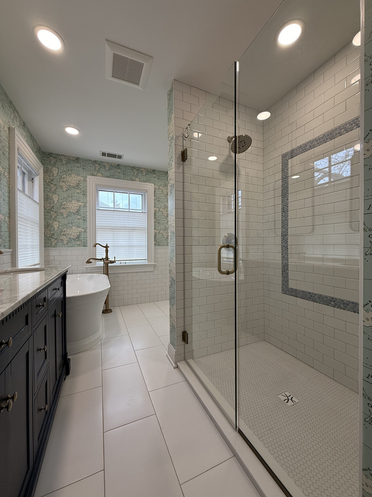 Luxury custom bathroom with marble floor tile and modern shower by Barbour Construction in South Bend