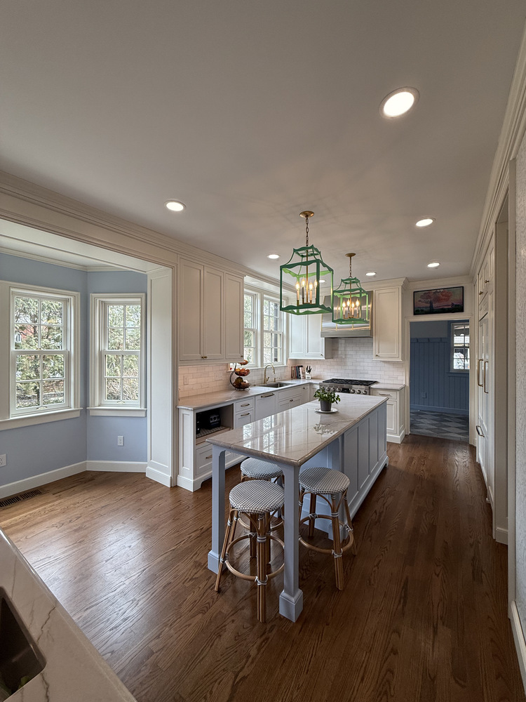 Open-concept kitchen with natural light and custom finishes by Barbour Construction in South Bend