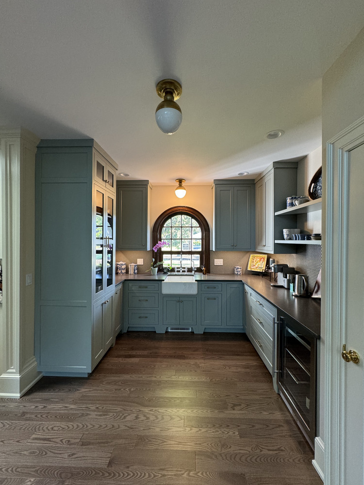 Barbour Construction wet bar with light green cabinets and wine fridge in South Bend, IN