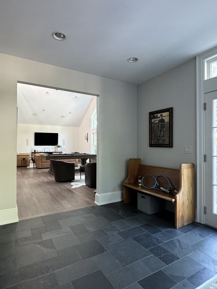 Entry to entertainment room from mudroom in South Bend custom home by Barbour Construction.