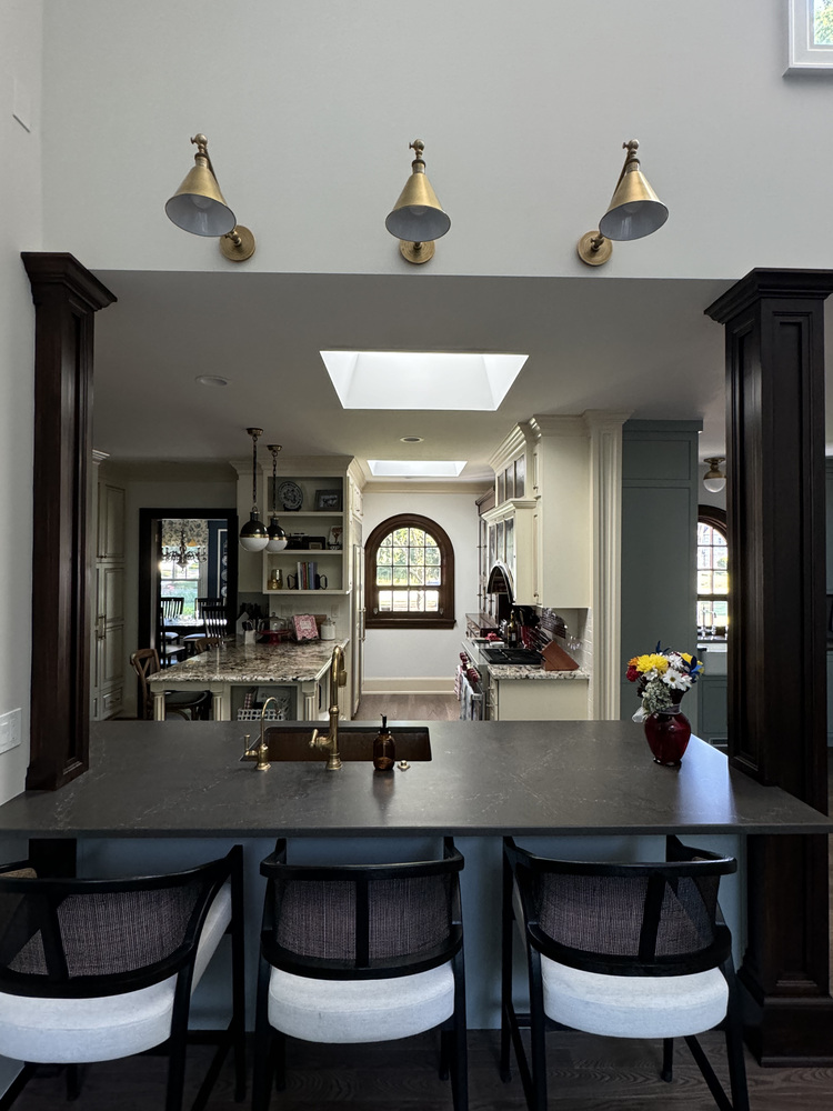 Kitchen and island view from living area in South Bend custom home by Barbour Construction.