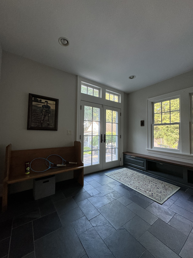 Mudroom bench and French door entry in custom home by Barbour Construction in South Bend, IN.