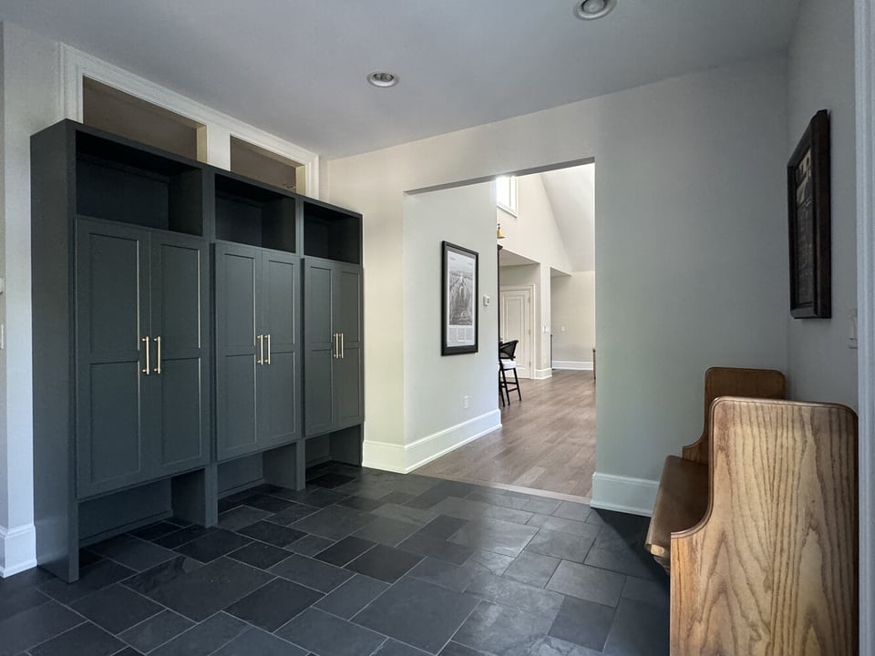 Mudroom hallway in custom South Bend home with built-in lockers by Barbour Construction.