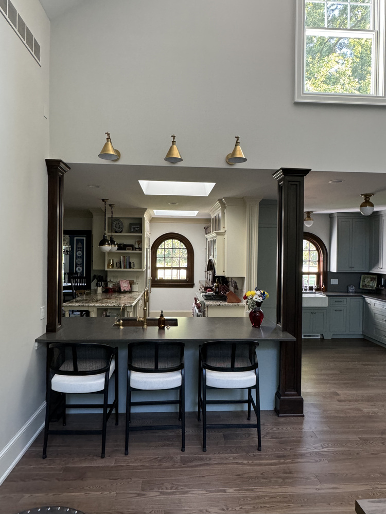 Transitional kitchen design in a South Bend custom home by Barbour Construction with open layout and brass fixtures.