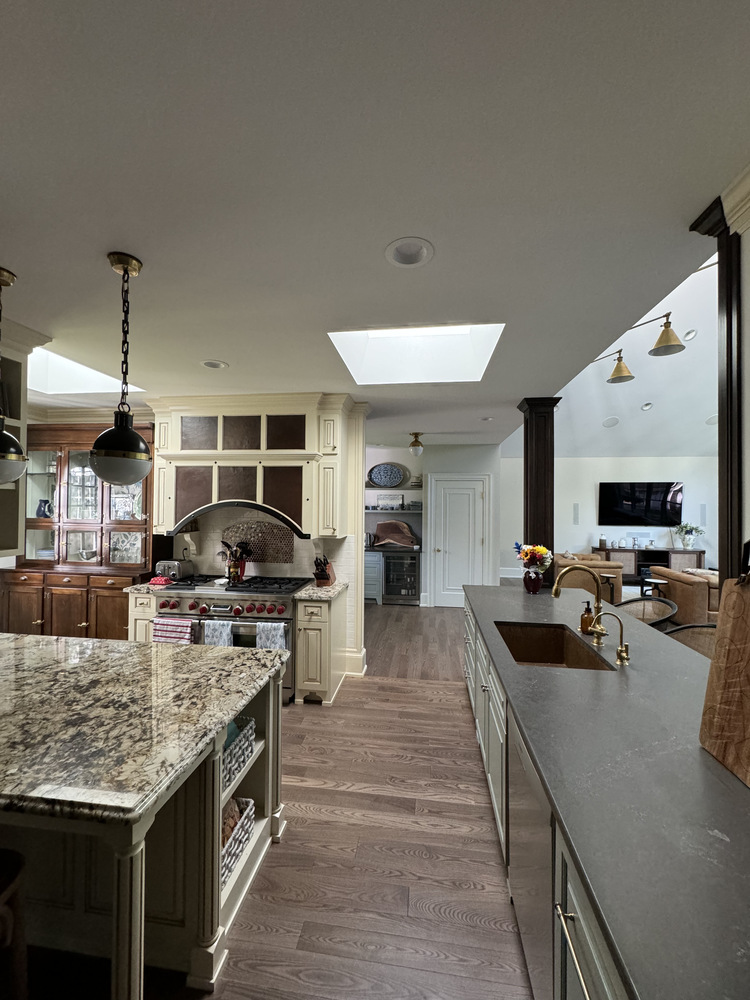 Transitional view from kitchen to living area in Barbour Construction custom home in South Bend