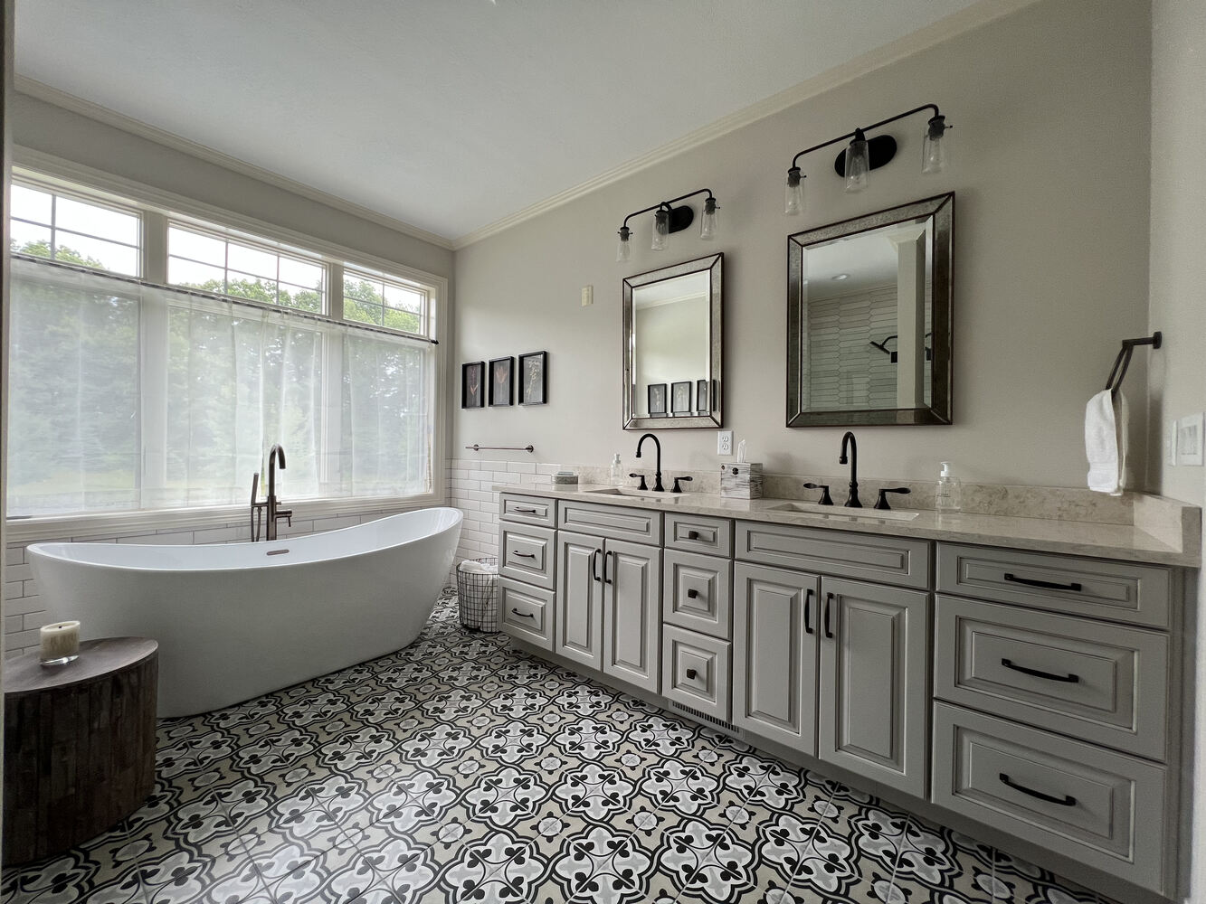 Custom bathroom with marble countertops and black fixtures by Barbour Construction in Dowagiac, MI.