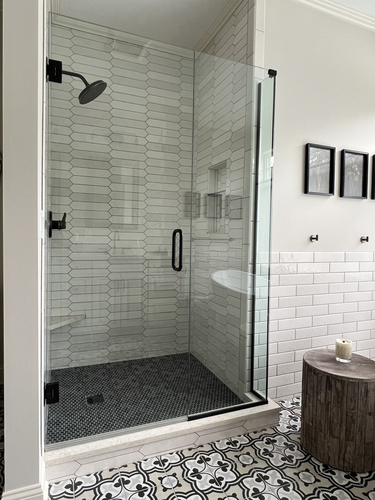 Frameless glass shower with modern tile pattern in Barbour Constructions Dowagiac, MI project.