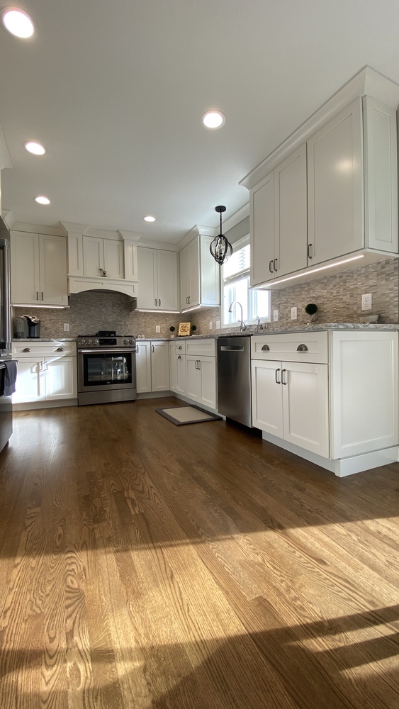 Full view of custom kitchen remodel with island and pendant lighting by Barbour Construction in Goshen, IN.