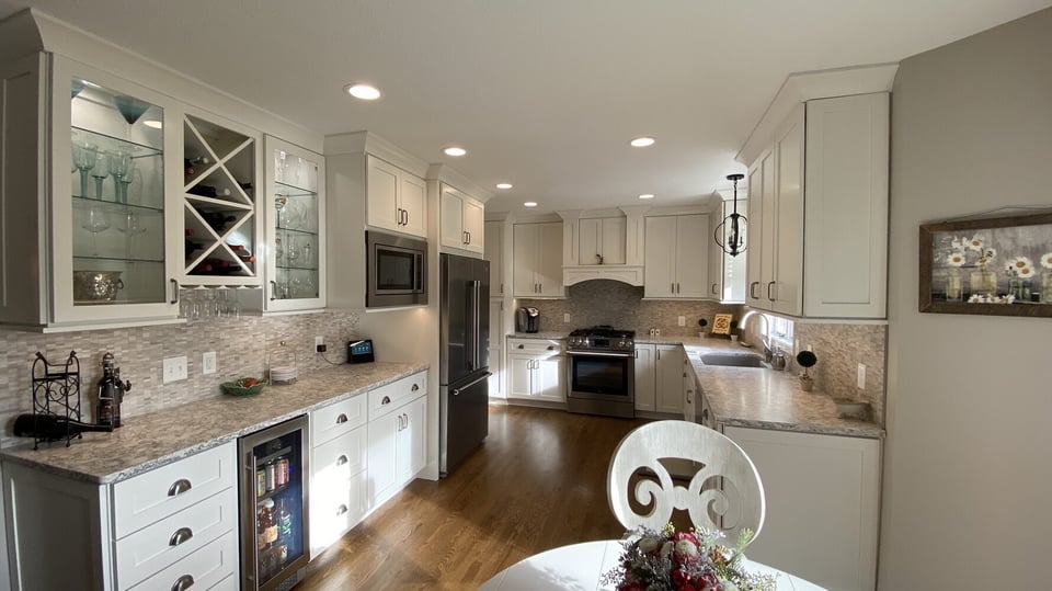 Kitchen renovation by Barbour Construction featuring full view of wine storage and cooking area in Goshen, IN.