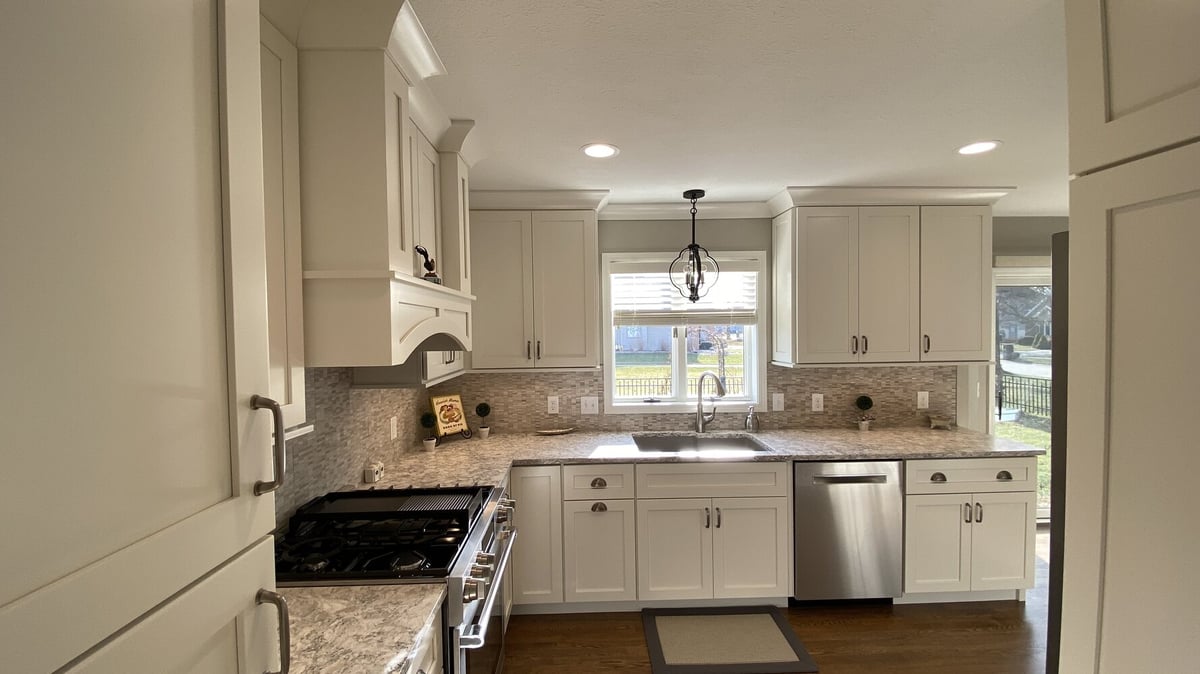 Light-filled kitchen with U-shaped layout and shaker cabinets by Barbour Construction in Goshen, IN.