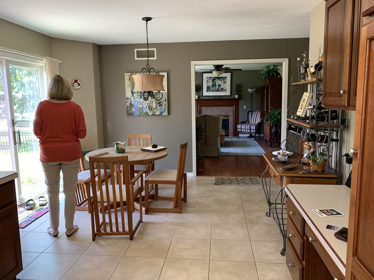 Outdated tile flooring and dark cabinetry shown in pre-renovation space by Barbour Construction in Goshen, IN.