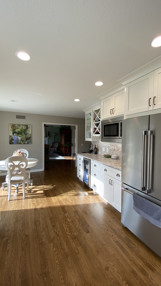 Transitional kitchen renovation with dining nook and bright natural light in Goshen, IN by Barbour Construction.