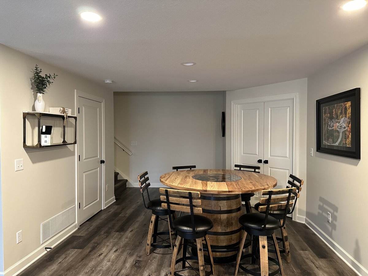 Basement nook with custom wood bar-height dining set in Barbour Construction home in New Carlisle, IN.
