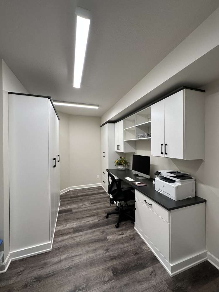 Custom home office with built-in cabinetry and desk by Barbour Construction in New Carlisle, IN.