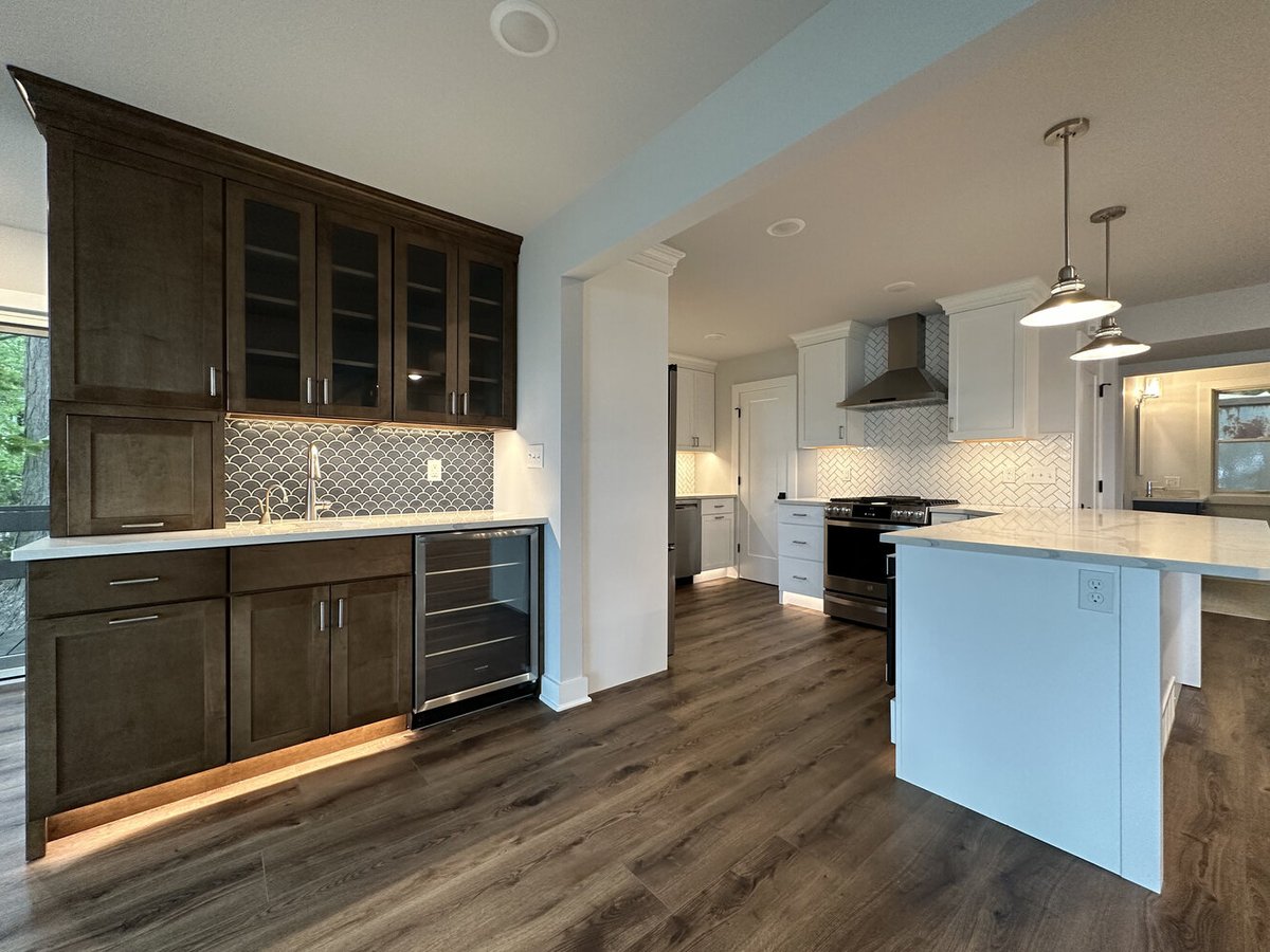 Open kitchen and beverage station with custom cabinetry in Barbour Construction Sawyer, MI home.