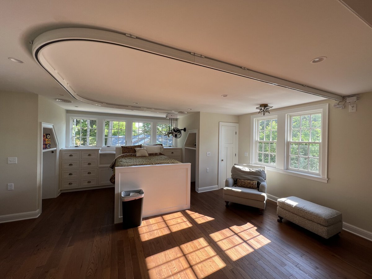 Barbour Construction designed custom suite with cozy seating and wood floors in South Bend, IN.