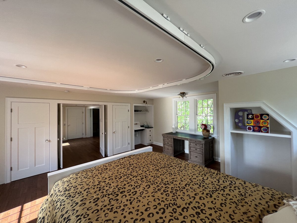 Custom bedroom design with dual workstations and white millwork by Barbour Construction in South Bend, IN.