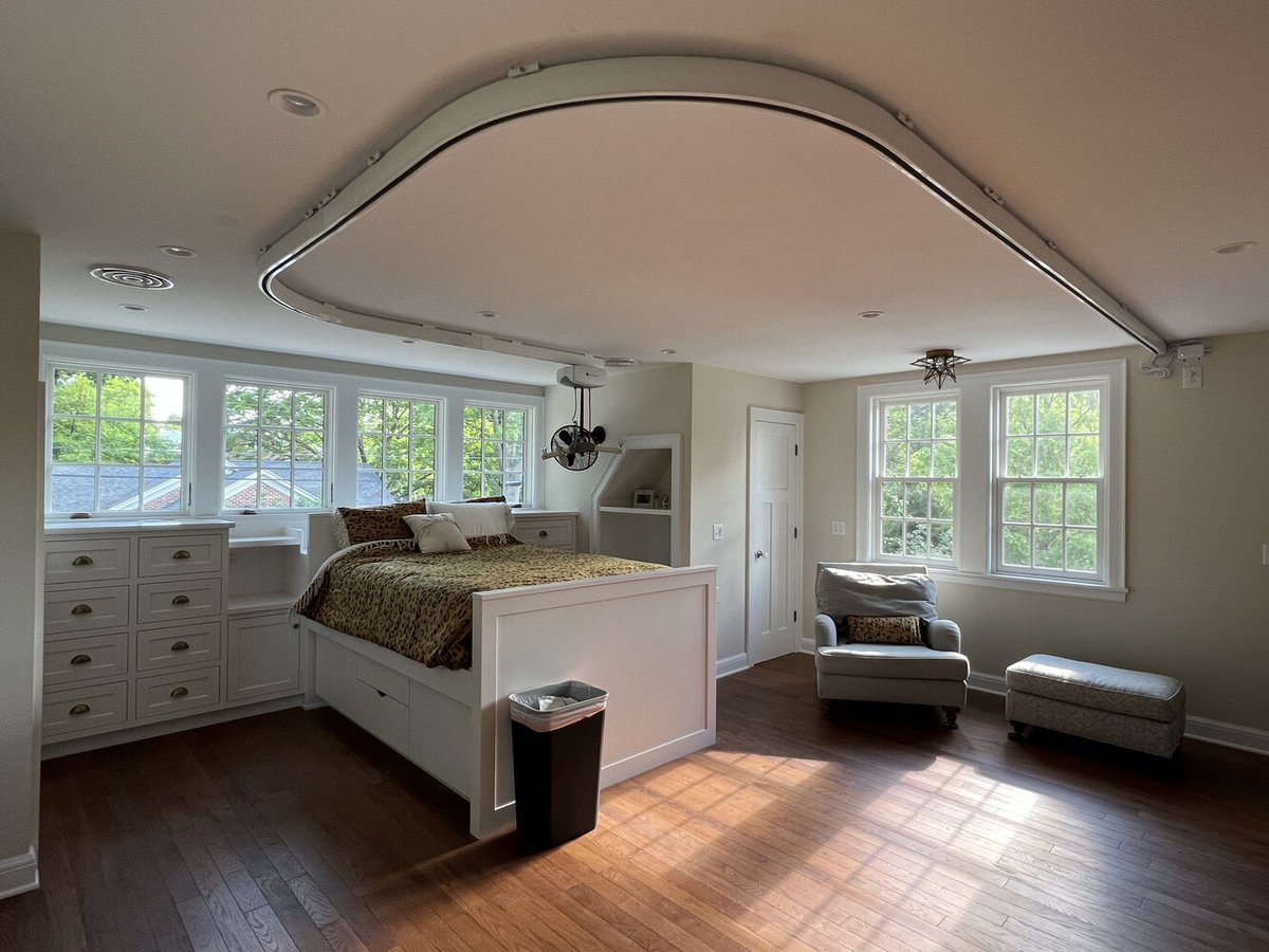 Spacious bedroom with built-in bed and natural light in South Bend home by Barbour Construction.
