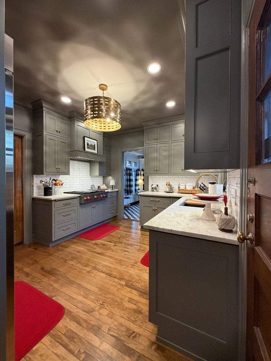 south bend kitchen remodel galley overview gray cabinets marble counters